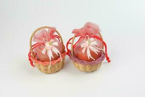 Egg flower or bunga telur a traditional malay wedding gift important part of reception door gift in bamboo basket photo