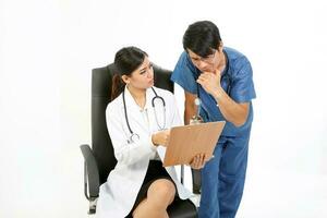 Young Asian male female doctor wearing apron uniform stethoscope sit on chair stand talk discuss photo