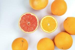 Orange grapefruit slice closeup on white background photo