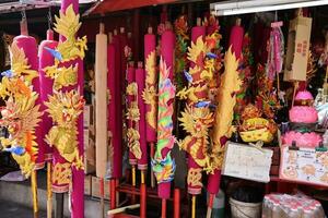 Georgetown, Penang, Malaysia-February 03, 2022- Colourful decorated prayer large joss sticks at Goddess of Mercy Temple. photo