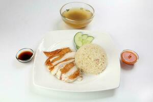 South east asian style chicken rice set steamed roasted sliced chicken with soup dark chilli sauce malaysia china photo