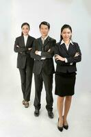 Young Asian male female wearing business office suit stand look at camera cross hand photo