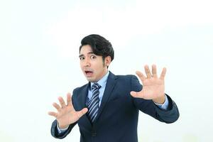 South east Asian Malay Man facial expression shocked scared afraid hand in front self protect photo
