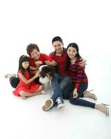 Southeast Asian multigeneration family parents daughter grandmother father mother child pose happy sit stand photo