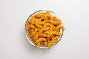 Deep fried battered onion pakoda slightly curly crispy spicy ready to eat snack photo