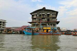 Taiping, Malaysia- August 18, 2019-Kuala Sepetang, formally known as Port Weld is a vibrant fishing village, popular tourist destination. Visiting charcoal factory, pink dolphin, eagle feeding etc, photo