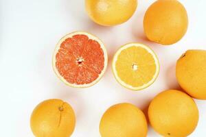 Orange grapefruit slice closeup on white background photo