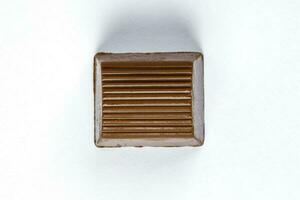Chocolate truffle hart square cube rose flower shape on white background photo
