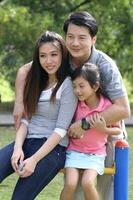 South East Asian young father mother daughter son parent boy girl child activity outdoors park photo