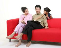 South East Asian young father mother daughter son parent girl child activity indoor photo