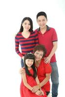 Southeast Asian multigeneration family parents daughter grandmother father mother child pose happy sit stand photo