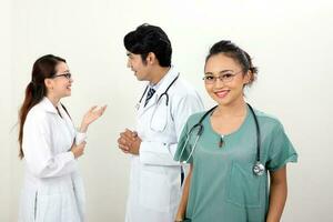 Young asian malay chinese male female doctor on white background smile confident looking at camera photo