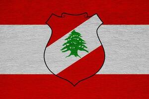 Flag of the Republic of Republic of Lebanon on a textured background. Concept collage. photo