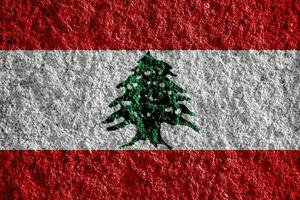 Flag of the Republic of Republic of Lebanon on a textured background. Concept collage. photo