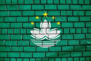 Macau flag on a textured background. Concept collage. photo