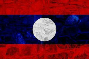 Lao People's Democratic Republic flag on a textured background. Concept collage. photo