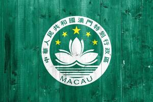 Macao bandera en un texturizado antecedentes. concepto collage. foto