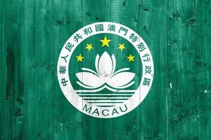 Macau flag on a textured background. Concept collage. photo