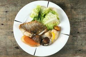 Grilled Seabass vegetable and salad photo