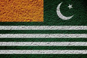 Flag of Azad Kashmir on a textured background. Concept collage. photo