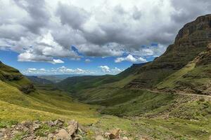 Dark cumulus clouds over the lower part of Sani Pass photo