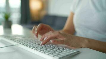 Female hands typing on a computer keyboard. Concept of remote work video