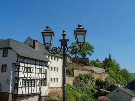 The small city of Saarburg at the saar river in germany photo