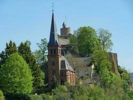 The small city of Saarburg at the saar river in germany photo