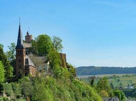 The small city of Saarburg at the saar river in germany photo