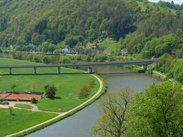 The small city of Saarburg at the saar river in germany photo