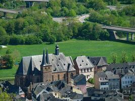 The small city of Saarburg at the saar river in germany photo