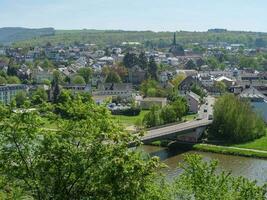 The small city of Saarburg at the saar river in germany photo