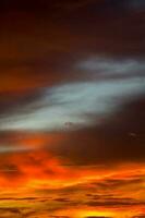 colorful red, blue, and yellow sky in the evening in a rural area in Thailand, when the sun has set, is a panoramic view of the warmth. Hot, hot and scary photo