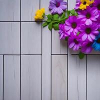 Beautiful flowers on a wooden background, A Wooden flooring against beautiful flowers garden. photo