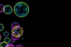 Soap bubbles corner overlay black background photo