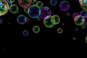 Soap bubbles top border overlay black background photo