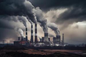 Power plant with smoking chimneys on a background of blue sky. coal energy production industry produces electricity through the combustion of coal and closing environment problem, photo