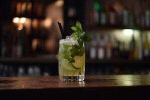 Mojito cocktail on bar counter. Cocktail with lime, mint, ice. A delicious mojito drink on the bar counter in a beachfront setting, garnished with fresh mint leaves and a slice of lime, photo