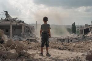 A young boy stands in the ruins of a destroyed building and looks into the distance. A small boy standing amidst the destruction of a war torn area, photo