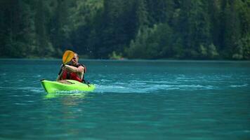 Caucasian Kayaker in His 40s Paddling on the Scenic Weissensee Lake in Slow Motion Footage video