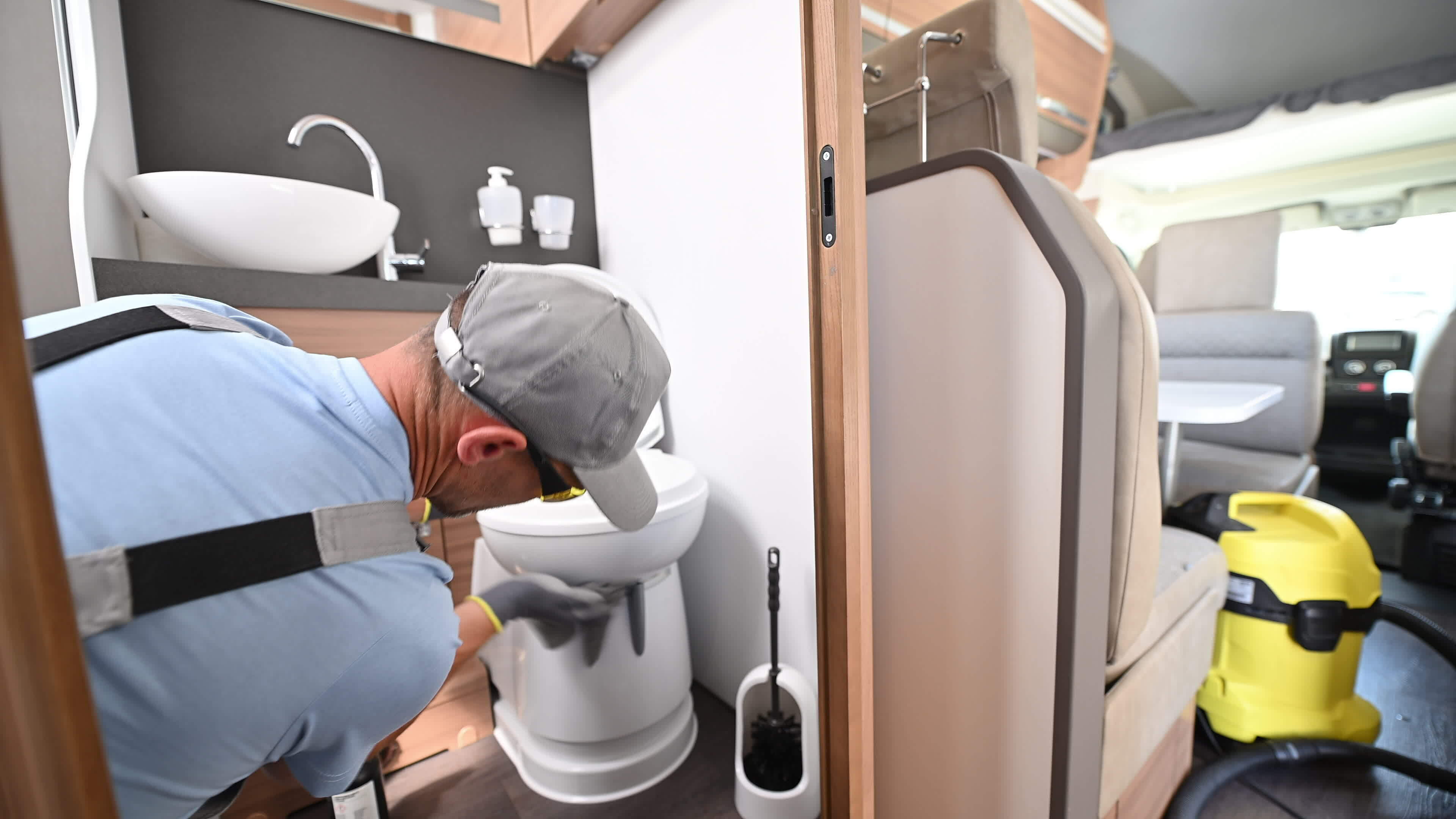 Clean and Disinfect a RV Camper Van Toilet Bowl 24572207 Stock Video at