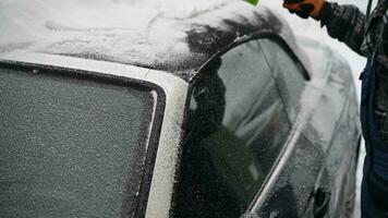 Driver Softly Removing Fresh Fallen Snow From His Car video