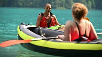 Caucasian Kaykers Hanging Out on a Scenic Lake video