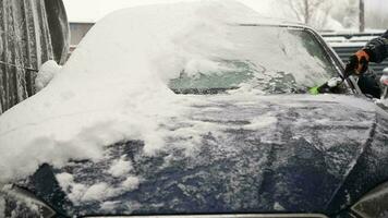 Men Removing Snow From a His Car video