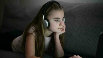 Girl with Headphones Enjoying Online Learning in Front of Her Laptop Computer video