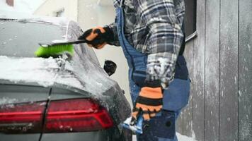 Cleaning His Modern Car From Snow and Ice video