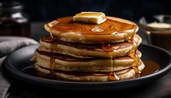 Stack of homemade pancakes with syrup pouring photo