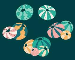 collection of round sea urchins in groups and singles with stripes and dots. vector