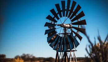 Antique windmill turning in sunset, powering rural farm with alternative energy generated by AI photo