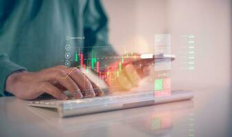 financial investment concept, businessman typing on computer keyboard  touching virtual trading graph buy and sell share in concept of investment business growth and marketing photo